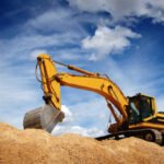 Excavator performing earthworks